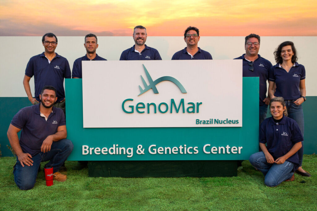 GeonMar employees standing at the entrance board of the Breeding and Genetics Centre in Monte do Carmo, Tocantins, Brazil.